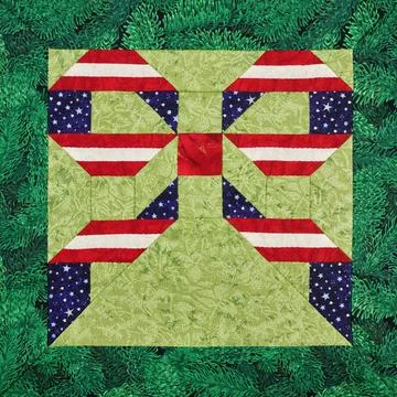 Patchwork block. Stars and stripes USA bowknot on a green background Fotos de archivo