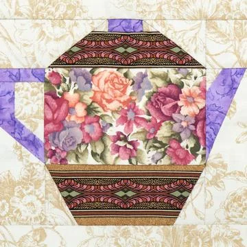 Patchwork block of the teapot with a pattern of flowers Stock Photos