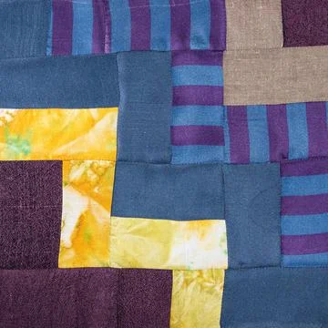 Patchwork cloth from blue and yellow fabrics Stock Photos