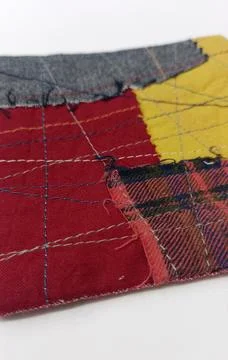 Patchwork coaster with geometric fabric composition Stock Photos