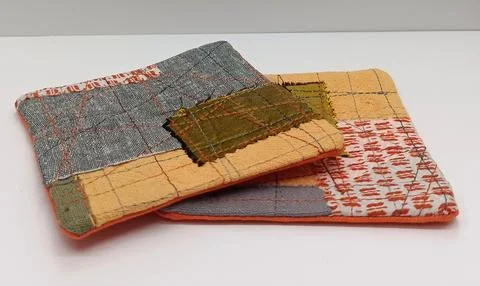 Patchwork coaster made with fabric scraps Stock Photos