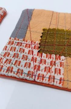 Patchwork coaster made from recycled cloth Stock Photos