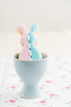 Patchwork Easter bunny sugar cookie in egg cup Stock Photos