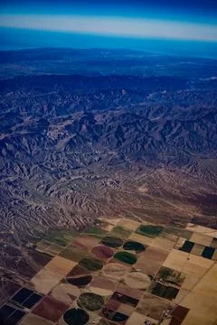 Patchwork of farmland and mountains 스톡 사진