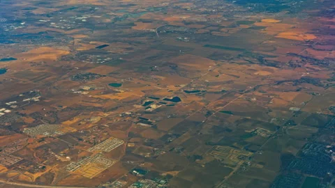 Patchwork Farmland and Rural Development Across Open Plains 動画素材 337902478