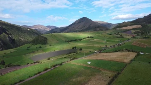 Patchwork Farmland and Volcanic Peak Under a Blue Sky Stock Footage 344061920