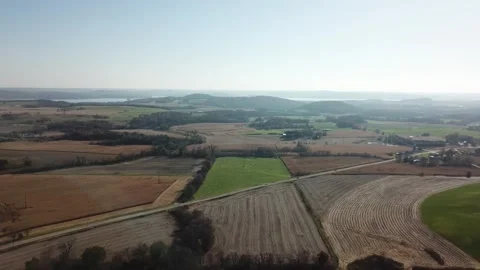 Patchwork farmland with plowed and green fields – aerial view Stock Footage 312020073