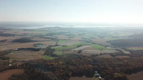 Patchwork farmland stretching toward Lake Wisconsin Stock Footage 311006576
