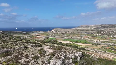 Patchwork farmland valley terraced fields limestone ridge mellieha countryside Stock Footage 343590934