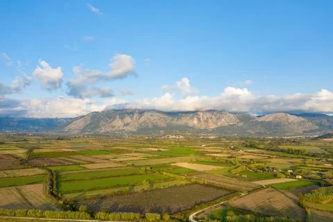 Patchwork fields and distant Greek mountains 스톡 사진