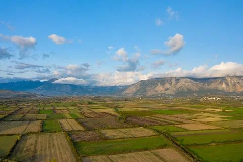 Patchwork fields below Greek mountain range 스톡 사진