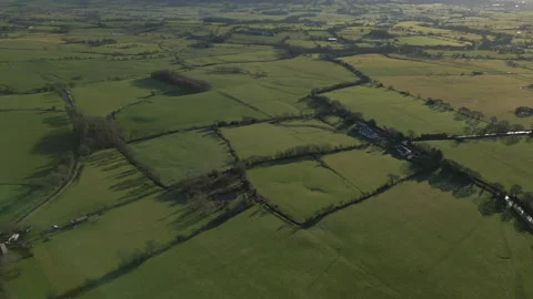 Patchwork fields english countryside daytime drone shot Video stock 232644416