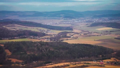 A patchwork of fields, forests, and villages of Southern Bohemia in aerial Video stock 268026494