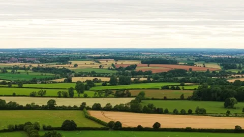 Patchwork fields with harvested wheat and grazing pastures. Wide countryside Stock Footage 344538834