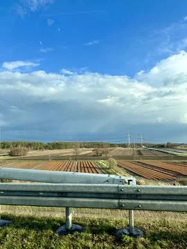 Patchwork Fields Under a Bright Blue Sky Stock Photos