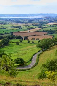 Patchwork fields, winding road, River Severn, Gloucestershire, UK 스톡 사진