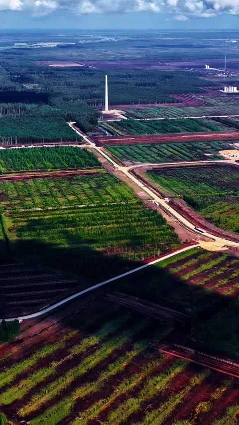 Patchwork of Forests and Farmlands with Towering Chimney View Stock-Footage 336394292