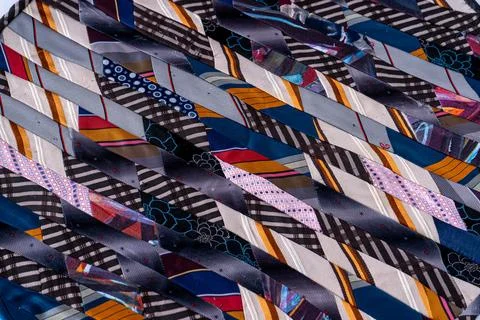 Patchwork. A fragment of multi-colored pieces of fabric sewn together. Stock Photos