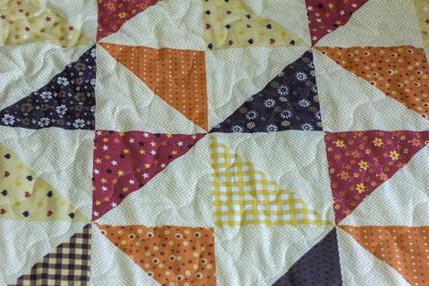 Patchwork. A fragment of a patchwork quilt as a background. Colored patchwork Stock Photos