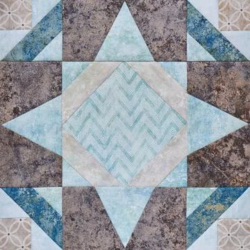 Patchwork geometric block from pieces of fabrics, detail of quilt Fotos de archivo