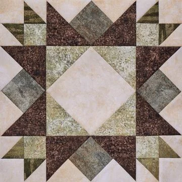 Patchwork geometric block from pieces of fabrics, detail of quilt Fotos de archivo