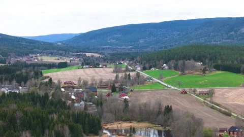 Patchwork green fields red farmhouses sit narrow country roads panorama layered Stock Footage 327624545