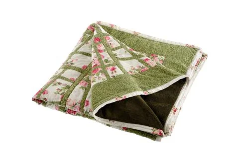 Patchwork green-white quilt on a white background. Patchwork blanket. Handmad Stock Photos