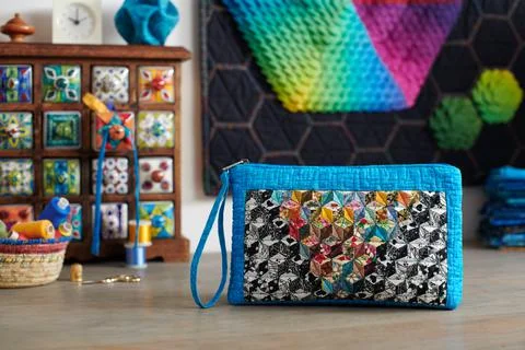 Patchwork handbag on the background.wooden mini chest with ceramic drawers Stock-Fotos