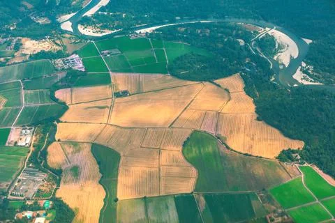Patchwork of harvested fields meets green farmland 스톡 사진