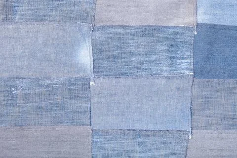 Patchwork from old blue denim flaps textile background - patchwork from ol... Foto stock
