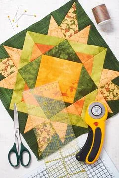 Patchwork orange-green block, quilting fabrics, sewing accessories 스톡 사진