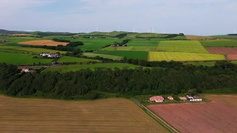 Patchwork Patterns of Coloured Farmland and Fields across Countryside Stock Footage 341357804