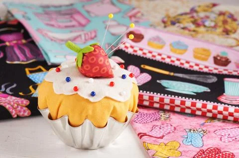 The patchwork pin cushion like a cupcake with strawberry Stock Photos