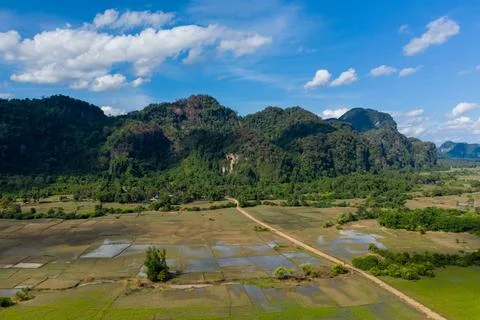 Patchwork rice paddies and forested limestone hills 스톡 사진