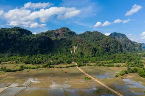 Patchwork rice paddies and limestone hills in Laos 스톡 사진
