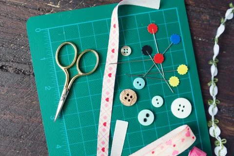 Patchwork sewing tools on green mat Stock Photos
