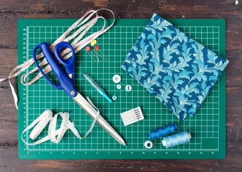 Patchwork sewing tools on green mat Stock Photos