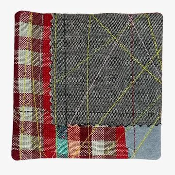 Patchwork square with mixed fabric textures close up Stockfoto's