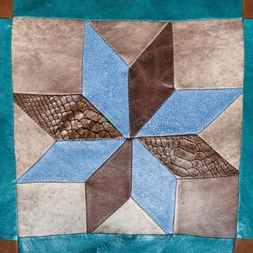 Patchwork star pattern on decorative pillow Stock Photos