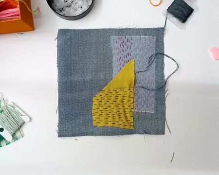 Patchwork textile art with running stitches.  Photos