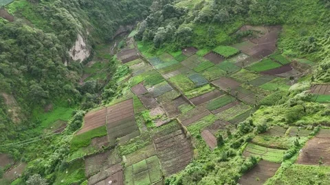 Patchwork Vegetable Farms in Mountain Valley Near Zunil Volcano Stock Footage 343579565