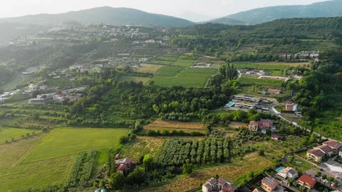 Patchwork of vineyards and rooftops on the fringe of Garda, Italy Stock Footage 319895168
