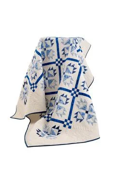 Patchwork white-blue quilt on a white background. Patchwork blanket. Handmade Foto stock