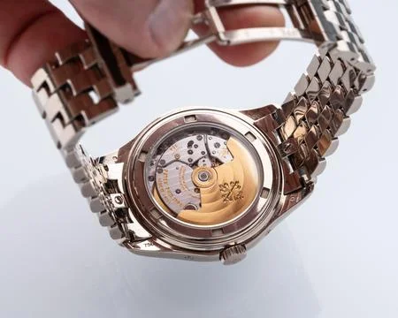 Patek Philippe watch case back view. Self-winding watch, 18kt white gold ca.. Stock Photos