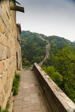Path along the Great Wall of China on a misty, summer day Stock Photos