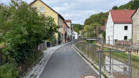 Path along the Krumbach stream in Zeil am Main, Germany Stock Footage 221356815