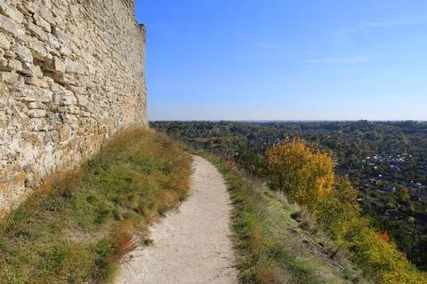 Path along the old stone wall Stock Photos