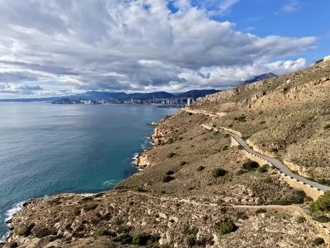 Path Along Seaside Cliffs And Clouds, Trail Running Along Cliffs Toward Dis.. Stock Photos