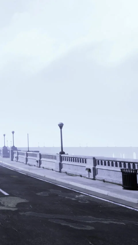 Path along the waterfront with trash bins and street lamps under cloudy sky Stock Footage 335968425