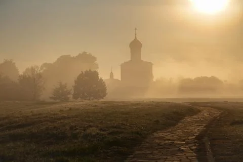 The path to the ancient Church of the Intercession on the Nerl in the fog Stock Photos